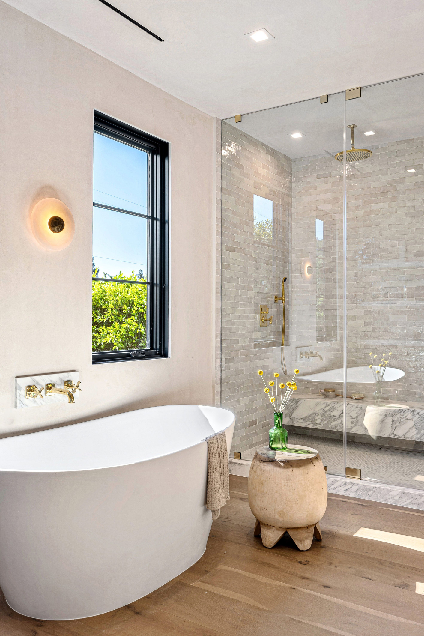 Luxury bathroom with freestanding tub and glass shower