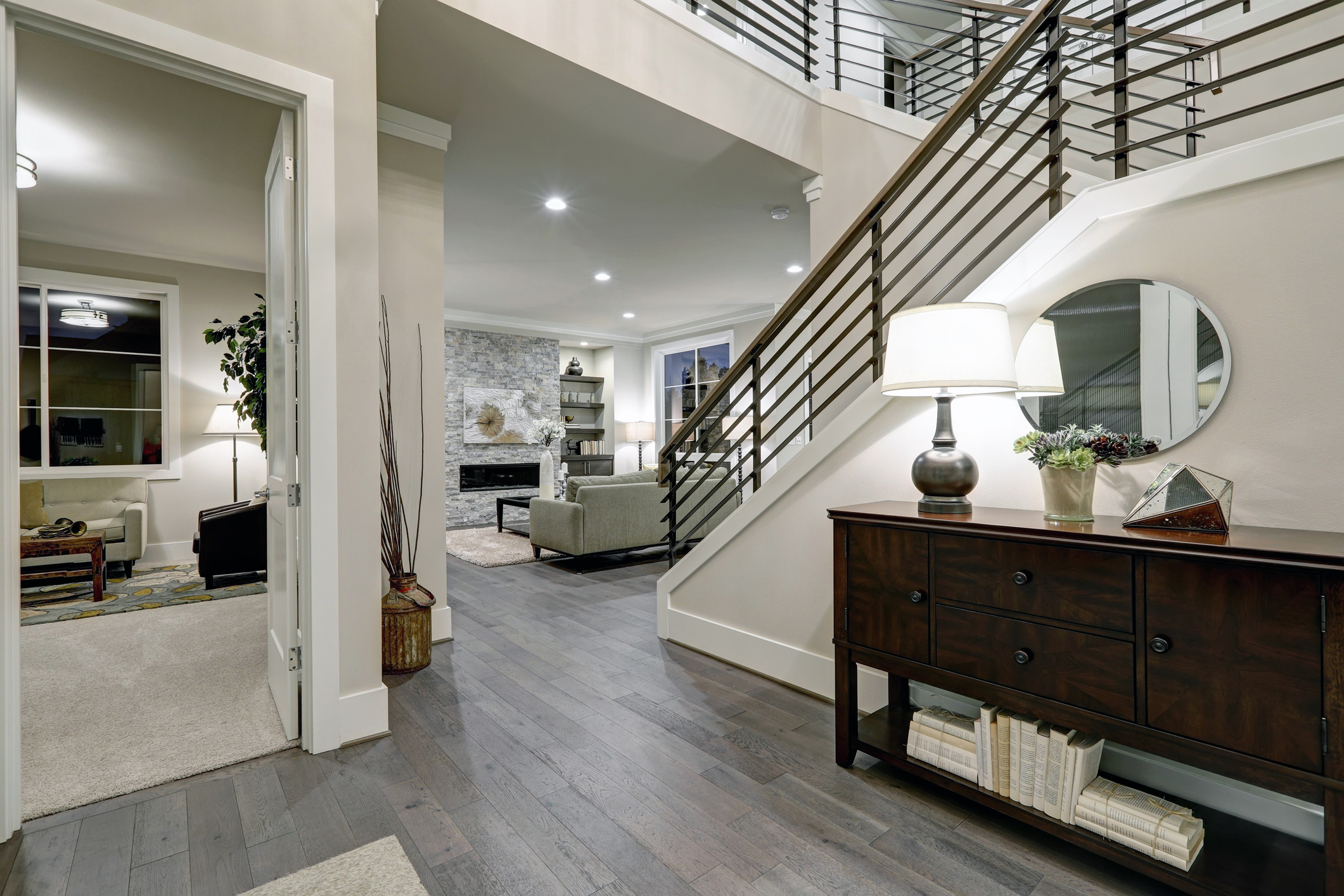 Modern entryway renovation with staircase and hardwood floors