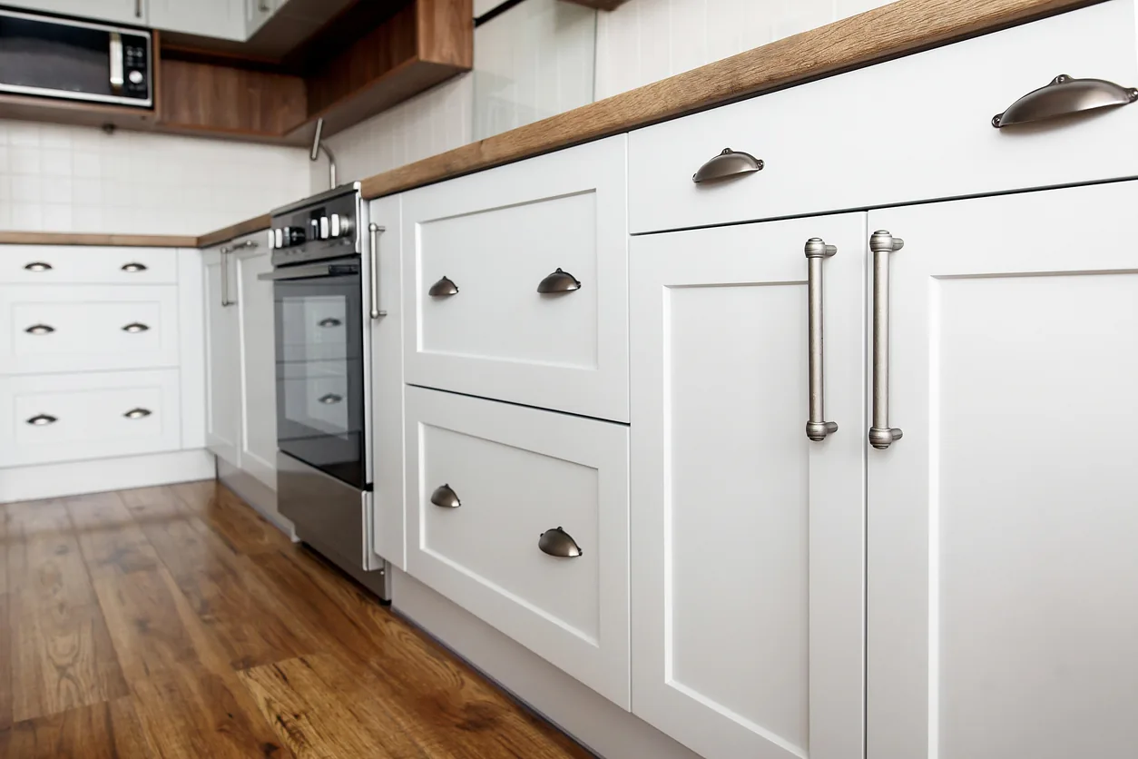 Kitchen cabinet detail with shaker style and cup pull hardware